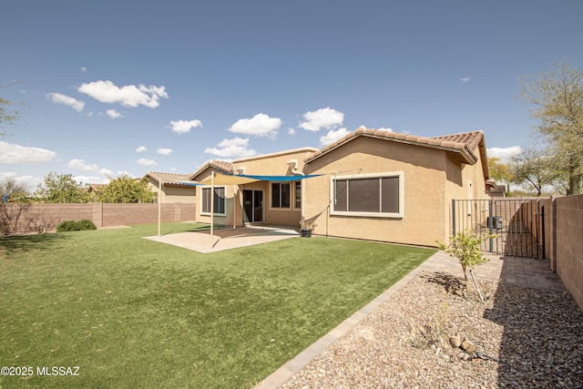 1419 W Red Creek Dr, Tucson, AZ 85737 - back of house featuring a fenced backyard, stucco siding, a gate, a patio area, and a tiled roof