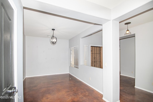 1419 W Red Creek Dr, Tucson, AZ 85737 - unfurnished room with finished concrete floors and a chandelier