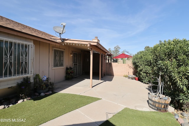 view of patio with fence