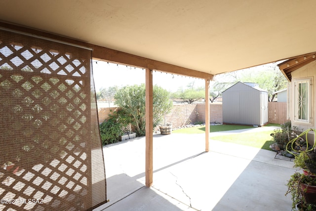 exterior space featuring a shed, a fenced backyard, and an outdoor structure