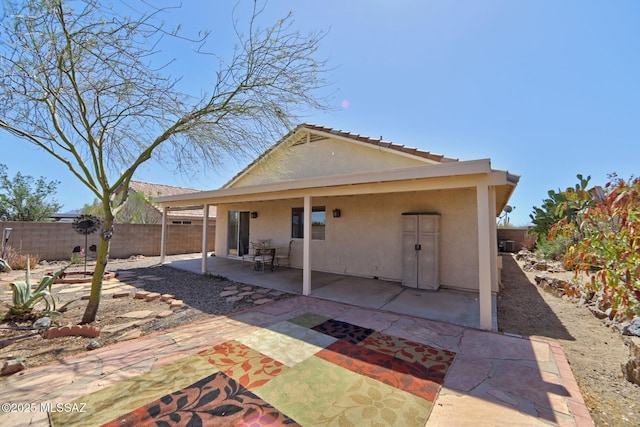 3625 N Avenida Albor, Tucson, AZ 85745 - back of house featuring a fenced backyard, stucco siding, and a patio