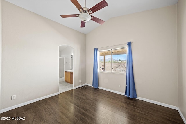 3625 N Avenida Albor, Tucson, AZ 85745 - spare room featuring vaulted ceiling, arched walkways, a ceiling fan, wood finished floors, and baseboards