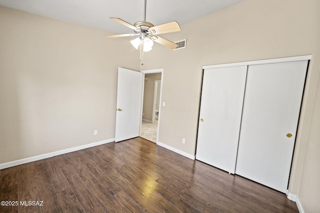 3625 N Avenida Albor, Tucson, AZ 85745 - unfurnished bedroom featuring wood finished floors, a closet, baseboards, and a ceiling fan