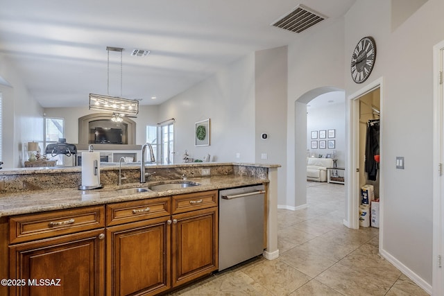 kitchen with stainless steel dishwasher, visible vents, a healthy amount of sunlight, and a sink