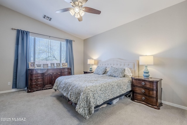 bedroom with visible vents, carpet, baseboards, and vaulted ceiling