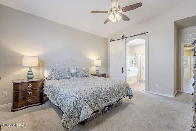 carpeted bedroom with visible vents, lofted ceiling, baseboards, a barn door, and arched walkways