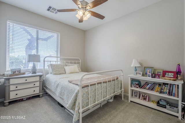 bedroom with carpet floors, baseboards, a ceiling fan, and visible vents