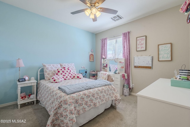 carpeted bedroom featuring baseboards, visible vents, and ceiling fan