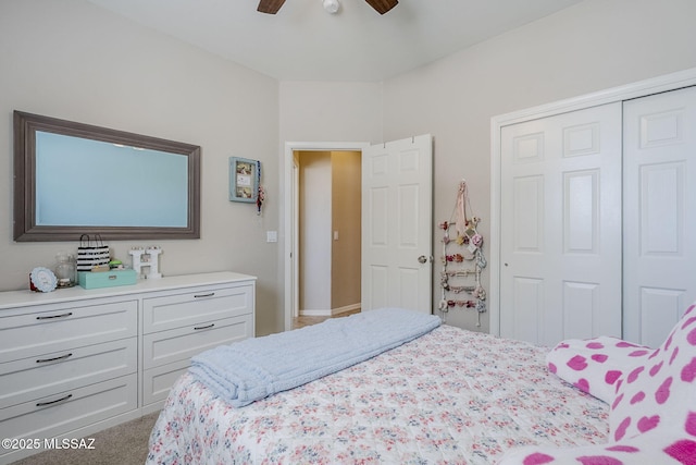 carpeted bedroom with a ceiling fan and a closet