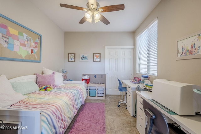 bedroom with ceiling fan and a closet