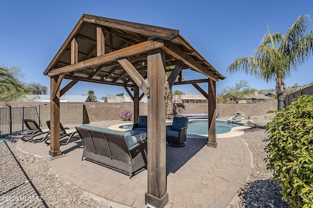 view of patio / terrace with a gazebo, a fenced in pool, and a fenced backyard