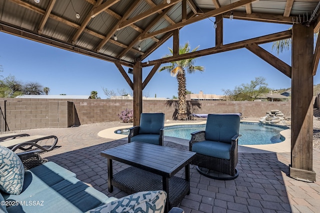 view of patio / terrace featuring a fenced backyard and a fenced in pool