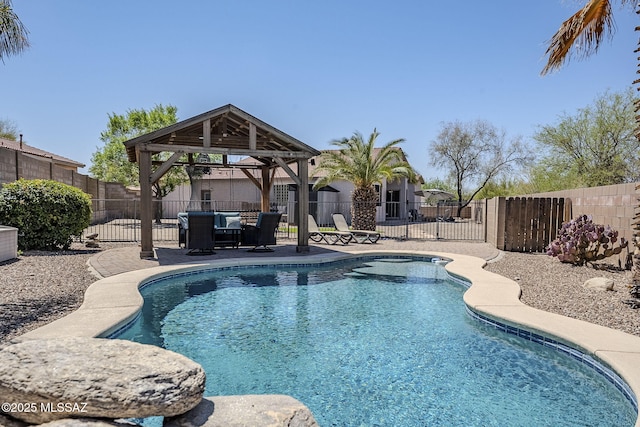 view of swimming pool featuring a gazebo, a fenced backyard, a fenced in pool, and a patio