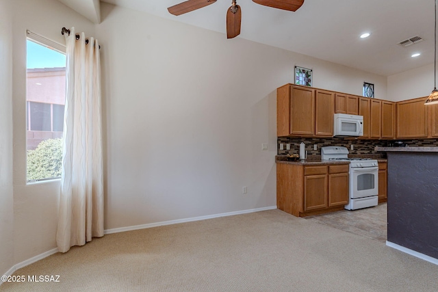 kitchen with white appliances, visible vents, ceiling fan, light colored carpet, and decorative backsplash