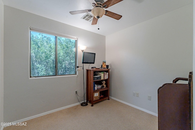 interior space featuring light carpet, ceiling fan, baseboards, and visible vents