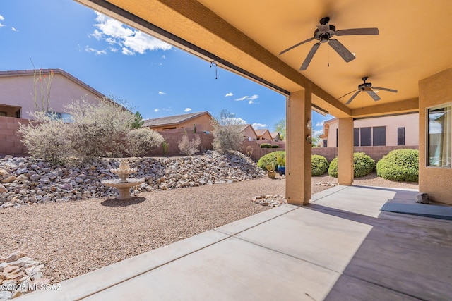 view of patio / terrace with a fenced backyard and a ceiling fan
