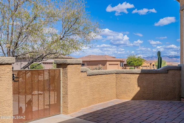 view of gate with fence