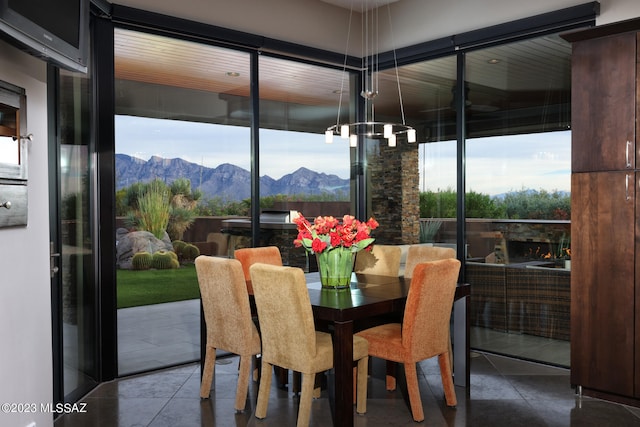 tiled dining space featuring a mountain view