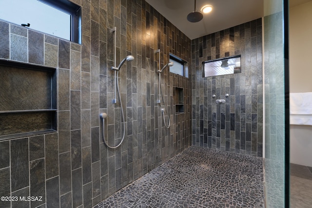 full bathroom with tiled shower