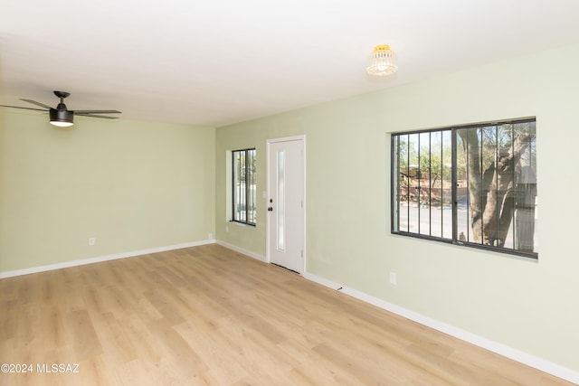 3030 N 2nd Ave, Tucson, AZ 85705 - unfurnished room with light wood-style flooring, baseboards, and ceiling fan