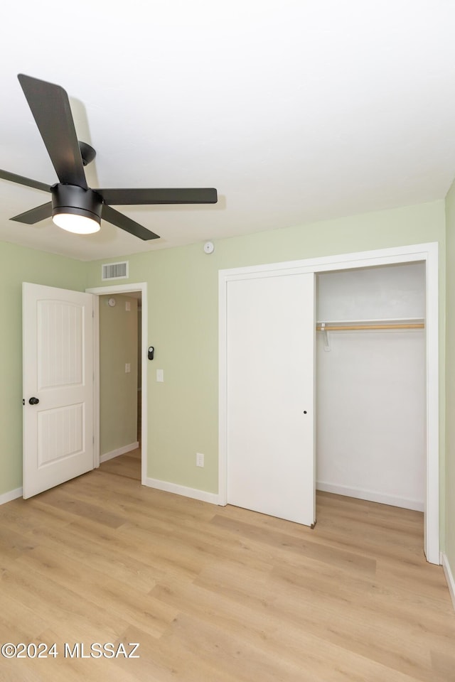 3030 N 2nd Ave, Tucson, AZ 85705 - unfurnished bedroom featuring a closet, baseboards, light wood finished floors, and visible vents