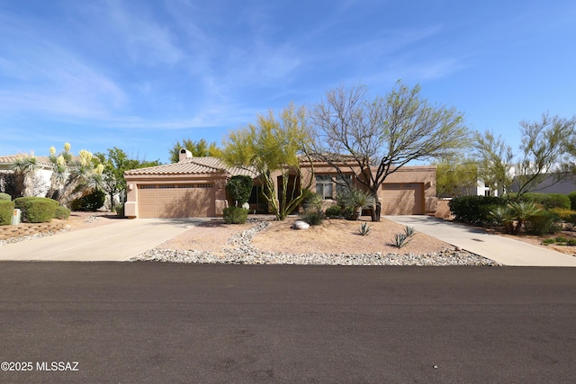view of front facade featuring a tiled roof, a garage, stucco siding, a chimney, and driveway
