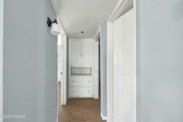 corridor with tile patterned flooring