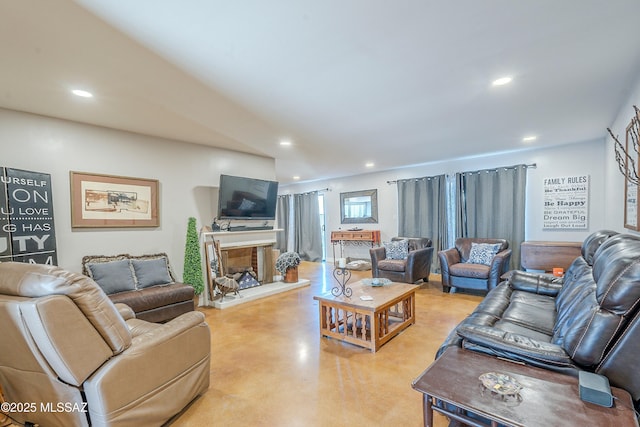 6120 E 5th St Unit B121, Tucson, AZ 85711 - living area featuring concrete flooring, recessed lighting, and a multi sided fireplace