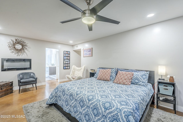 6120 E 5th St Unit B121, Tucson, AZ 85711 - bedroom featuring baseboards, recessed lighting, a ceiling fan, connected bathroom, and finished concrete flooring