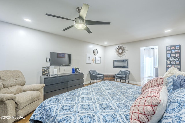 6120 E 5th St Unit B121, Tucson, AZ 85711 - bedroom with recessed lighting, a ceiling fan, wood finished floors, and baseboards