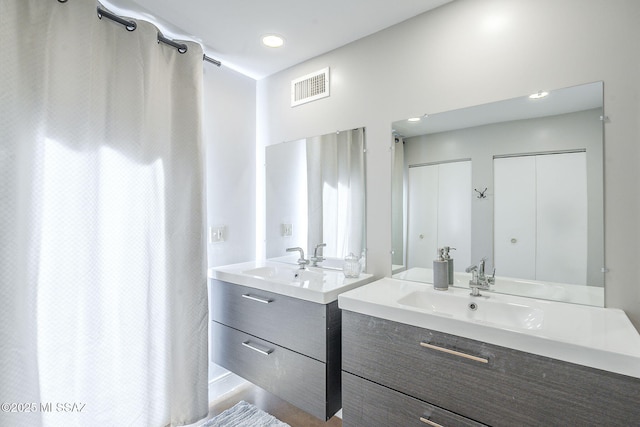 6120 E 5th St Unit B121, Tucson, AZ 85711 - full bath with two vanities and a shower with shower curtain
