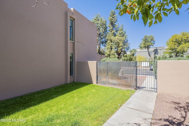 6120 E 5th St Unit B121, Tucson, AZ 85711 - view of yard with a gate