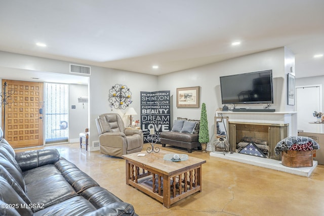 6120 E 5th St Unit B121, Tucson, AZ 85711 - living area featuring recessed lighting and a fireplace with raised hearth