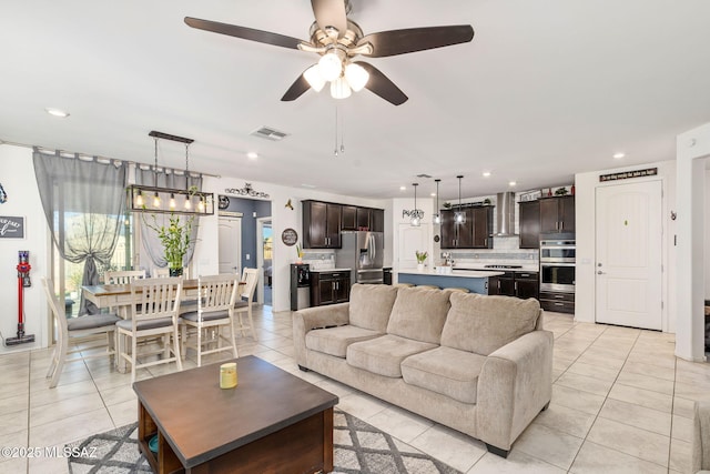 living room featuring visible vents, ceiling fan, recessed lighting, and light tile patterned flooring