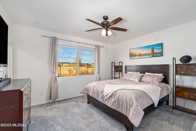 bedroom with carpet, baseboards, and ceiling fan