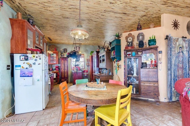 dining area featuring stone tile floors
