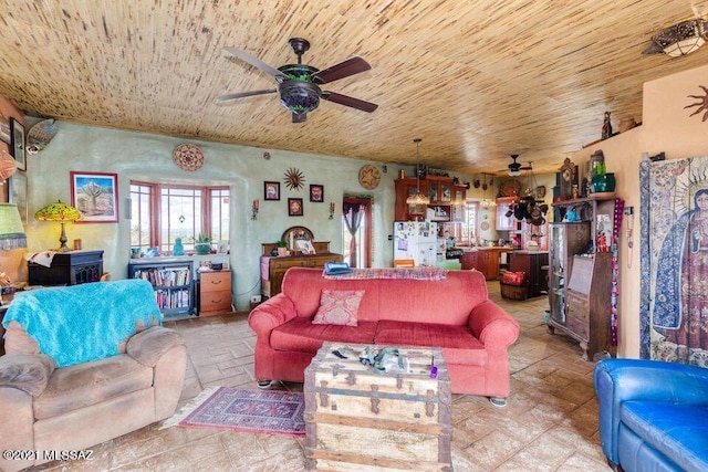 living room featuring wood ceiling and ceiling fan