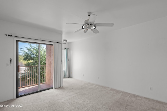 unfurnished room with carpet flooring and ceiling fan