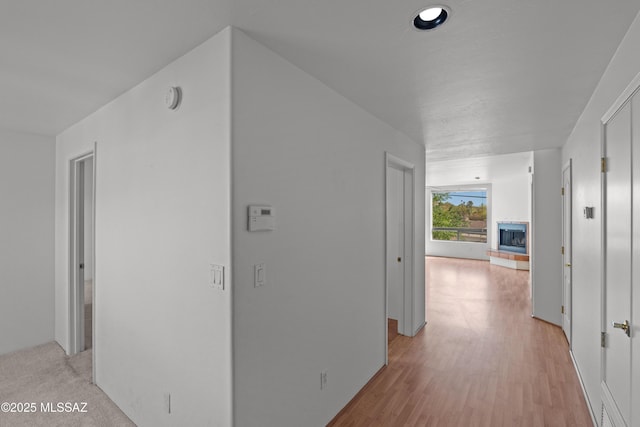 hallway with light wood-type flooring