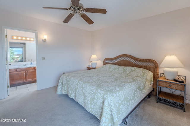 3055 S Placita De La Picaza, Green Valley, AZ 85622 - bedroom featuring light carpet, ensuite bathroom, and a ceiling fan