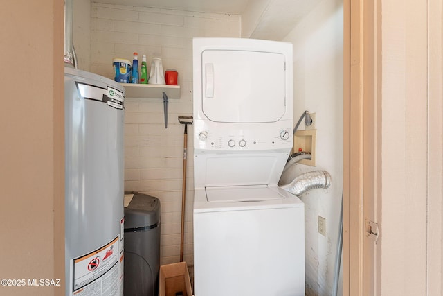 washroom featuring stacked washing maching and dryer and gas water heater