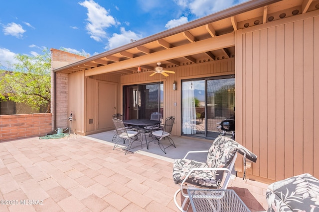 view of patio / terrace with outdoor dining space and ceiling fan