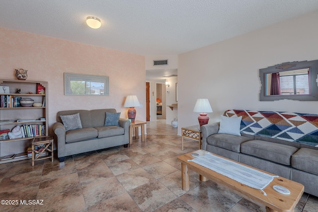 3055 S Placita De La Picaza, Green Valley, AZ 85622 - living room with healthy amount of natural light and stone finish floors
