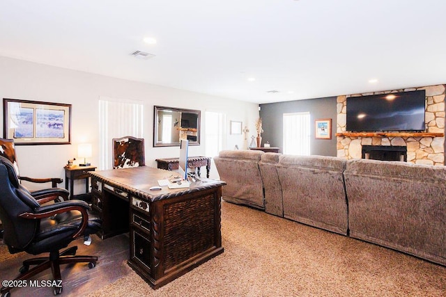 office featuring recessed lighting, visible vents, and a fireplace