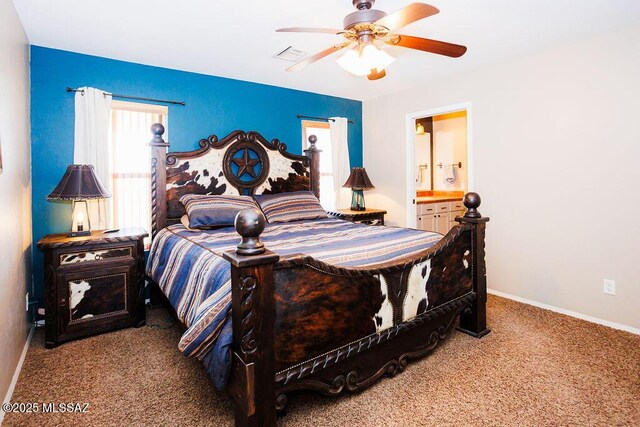 carpeted bedroom featuring baseboards, visible vents, connected bathroom, and ceiling fan