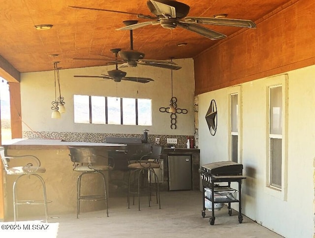view of patio featuring ceiling fan and outdoor wet bar