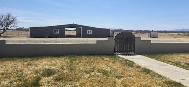view of home's exterior featuring fence private yard, a gate, and a garage
