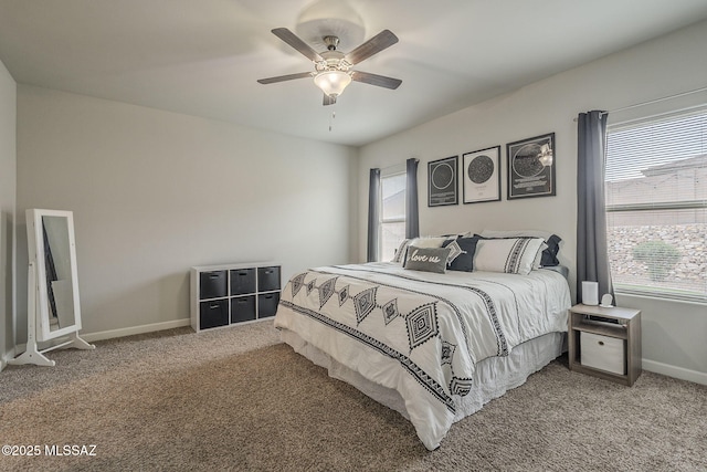 1117 W Valley Meadow Ln, Sahuarita, AZ 85629 - carpeted bedroom with multiple windows, baseboards, and a ceiling fan
