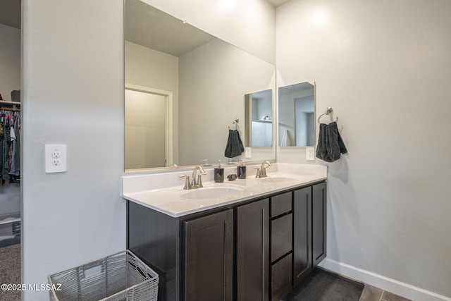 1117 W Valley Meadow Ln, Sahuarita, AZ 85629 - full bath featuring double vanity, baseboards, and a spacious closet
