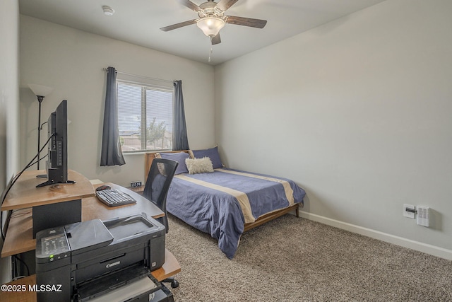 1117 W Valley Meadow Ln, Sahuarita, AZ 85629 - carpeted bedroom with baseboards, a desk, and ceiling fan